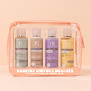 Trousse Voyage Cheveux bouclés Beauté Insolente, contient 4 essentiels au format 100ml shampoing Boucles, la Crème Boucles, la Crème 3 en 1 Pure énergie et la gelée Capillaire.